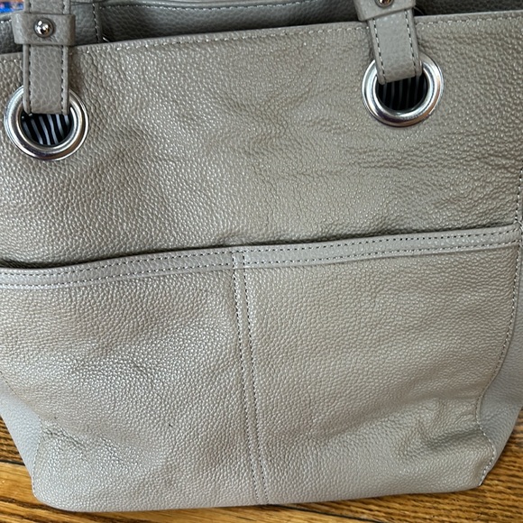 Taupe color leather tote.  Lots of pockets inside and out. - Picture 4 of 12
